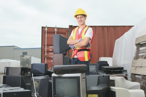 Estimator taking photos at site to prepare a free waste removal quote